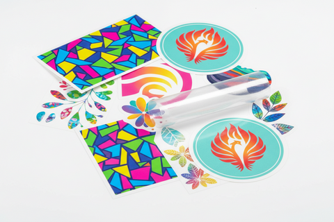 UV DTF sticker sheets with colorful custom designs and clear transfer film on a white background.